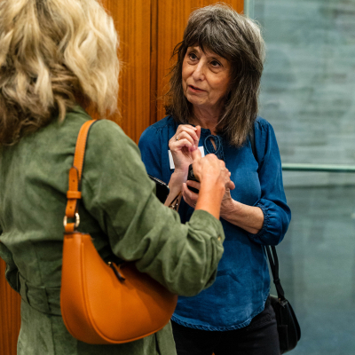 Two women in conversation at the reception