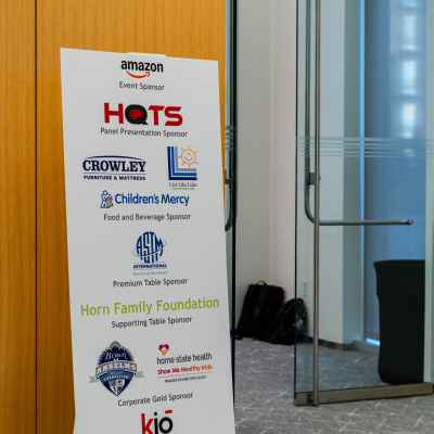 Event sponsor banner standing near the venue entrance