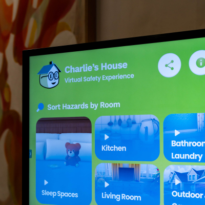 Close-up of the Charlie's House Virtual Safety Experience menu on a display screen