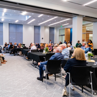 Wide view of the audience listening to the panel discussion
