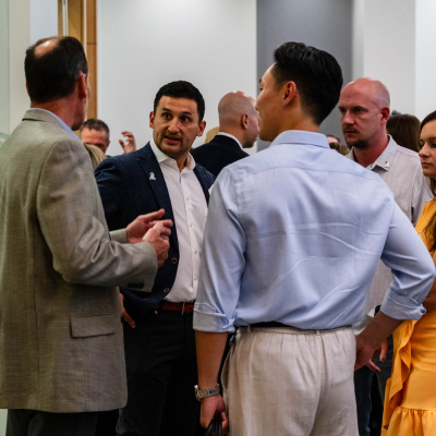 Guests gathered in conversation inside the event room