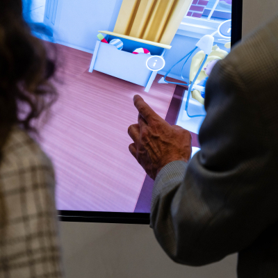Guest exploring a virtual child's room on the Charlie's House safety display