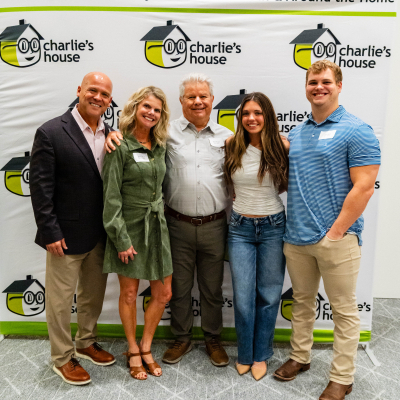 Five guests standing together in front of the Preventing Accidents & Injuries banner