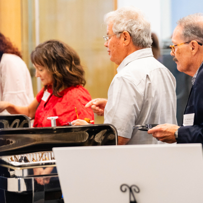 Guests in line at the buffet table during the reception